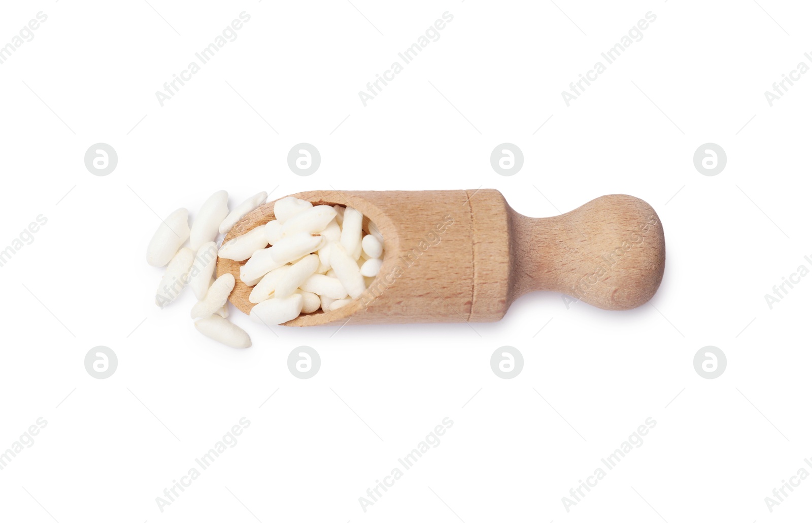 Photo of Puffed rice in wooden scoop isolated on white, top view