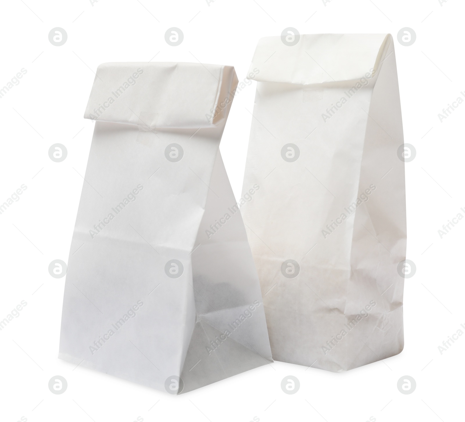 Photo of Two closed paper bags isolated on white