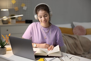 Photo of Student preparing for exam at table indoors