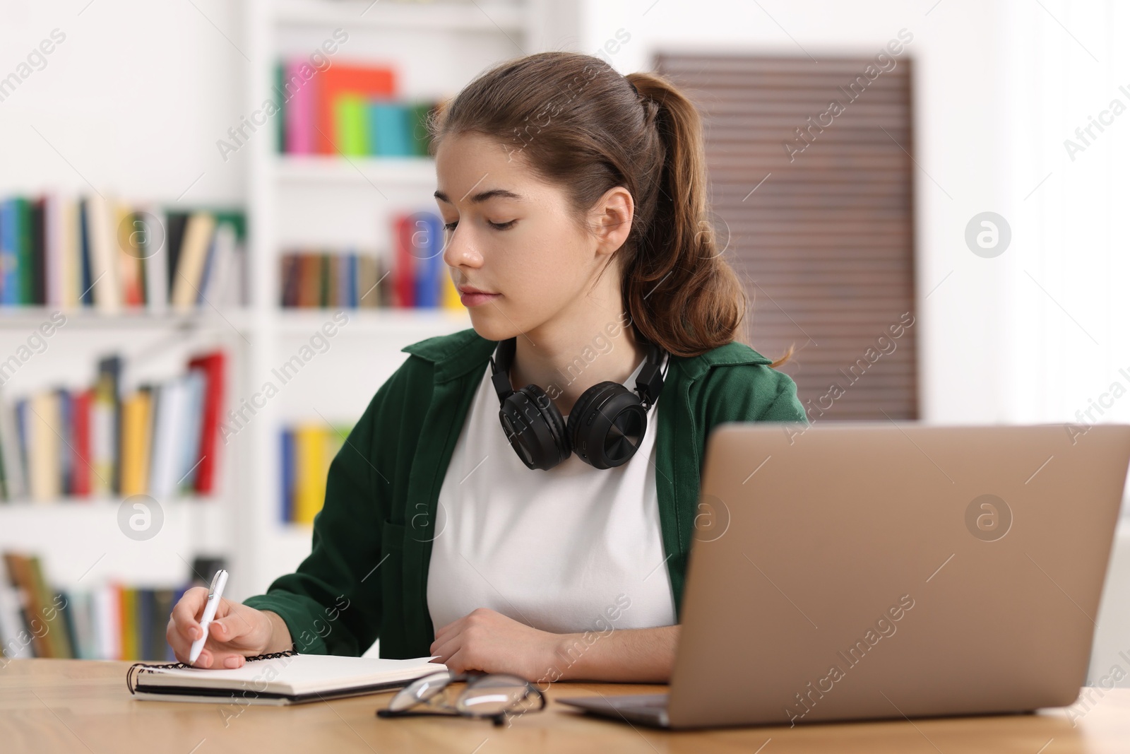 Photo of Student preparing for exam at table indoors