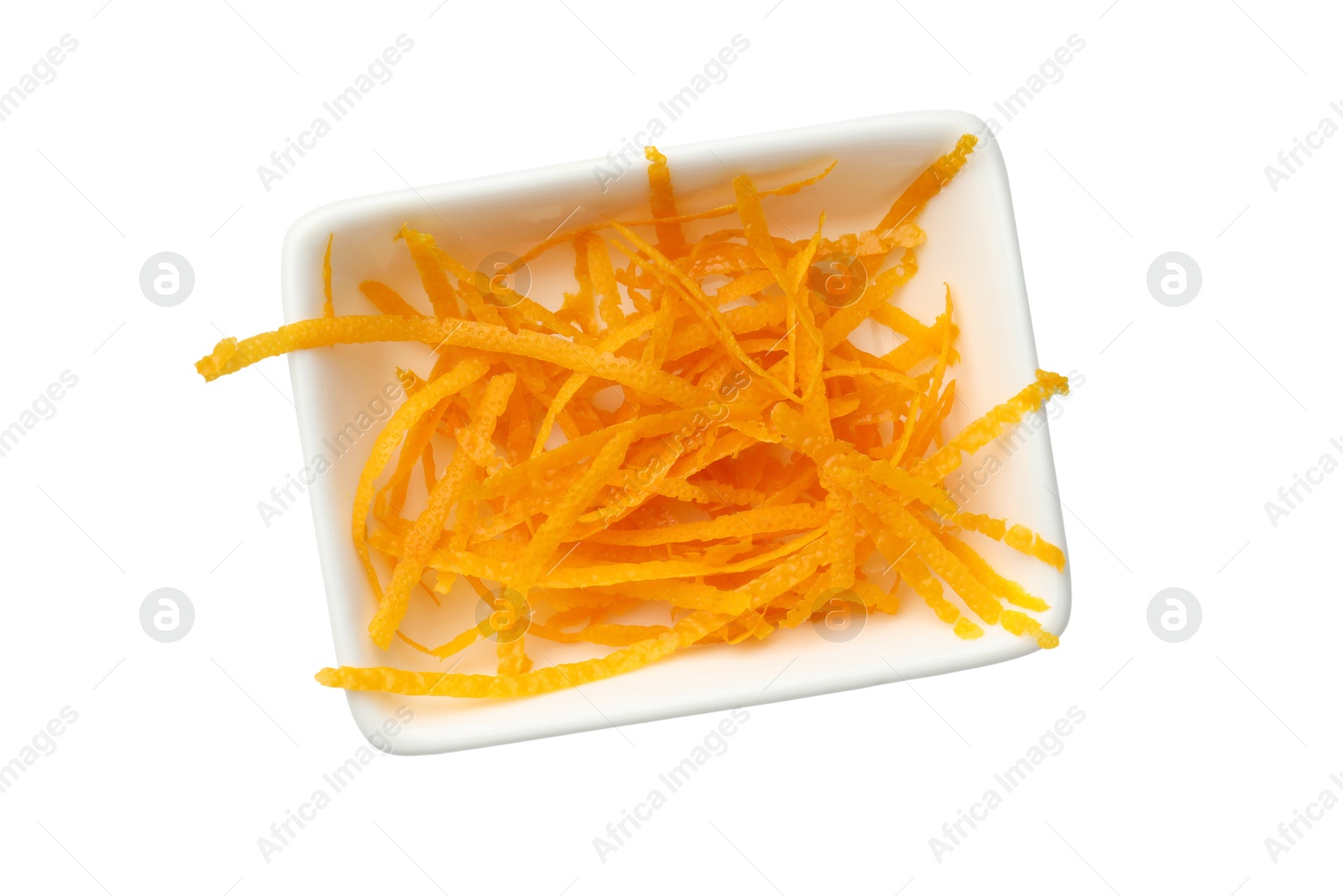 Photo of Orange zest in bowl isolated on white, top view