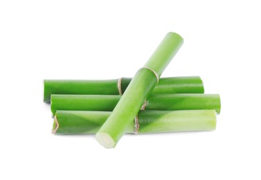 Photo of Pieces of decorative bamboo plant isolated on white