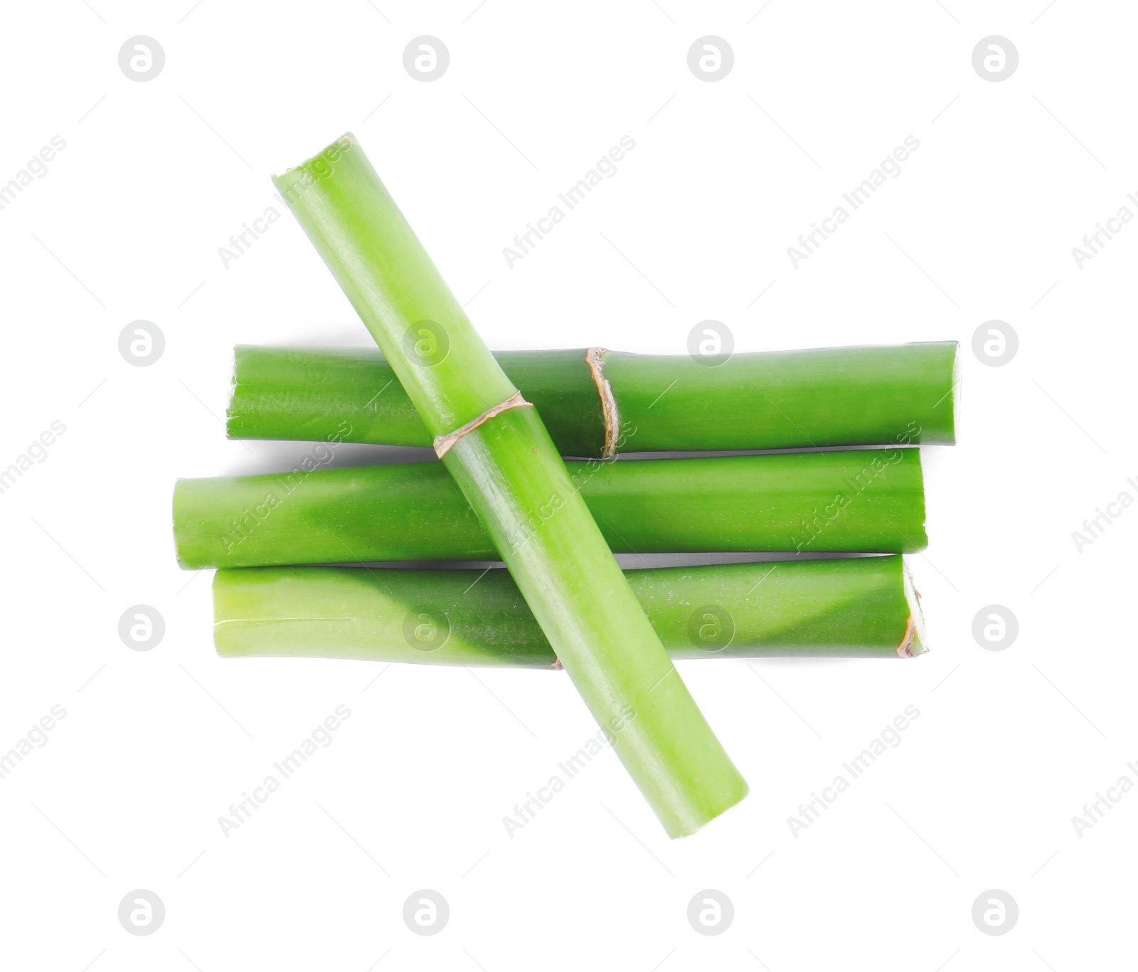 Photo of Pieces of decorative bamboo plant isolated on white, top view