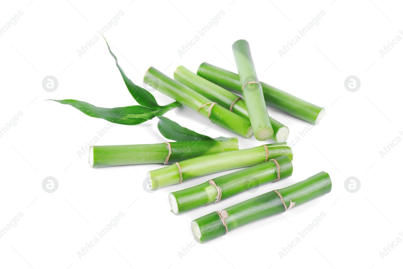 Photo of Pieces of decorative bamboo plant and green leaves isolated on white