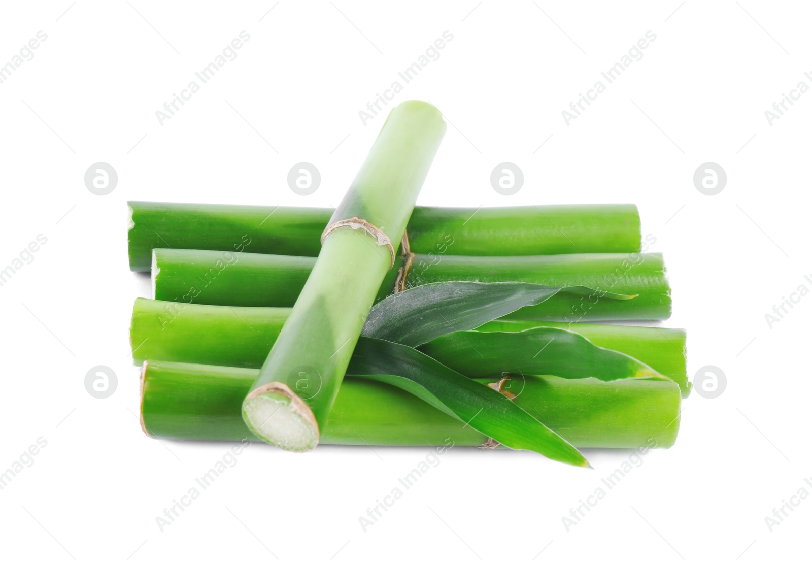 Photo of Pieces of decorative bamboo plant and green leaves isolated on white