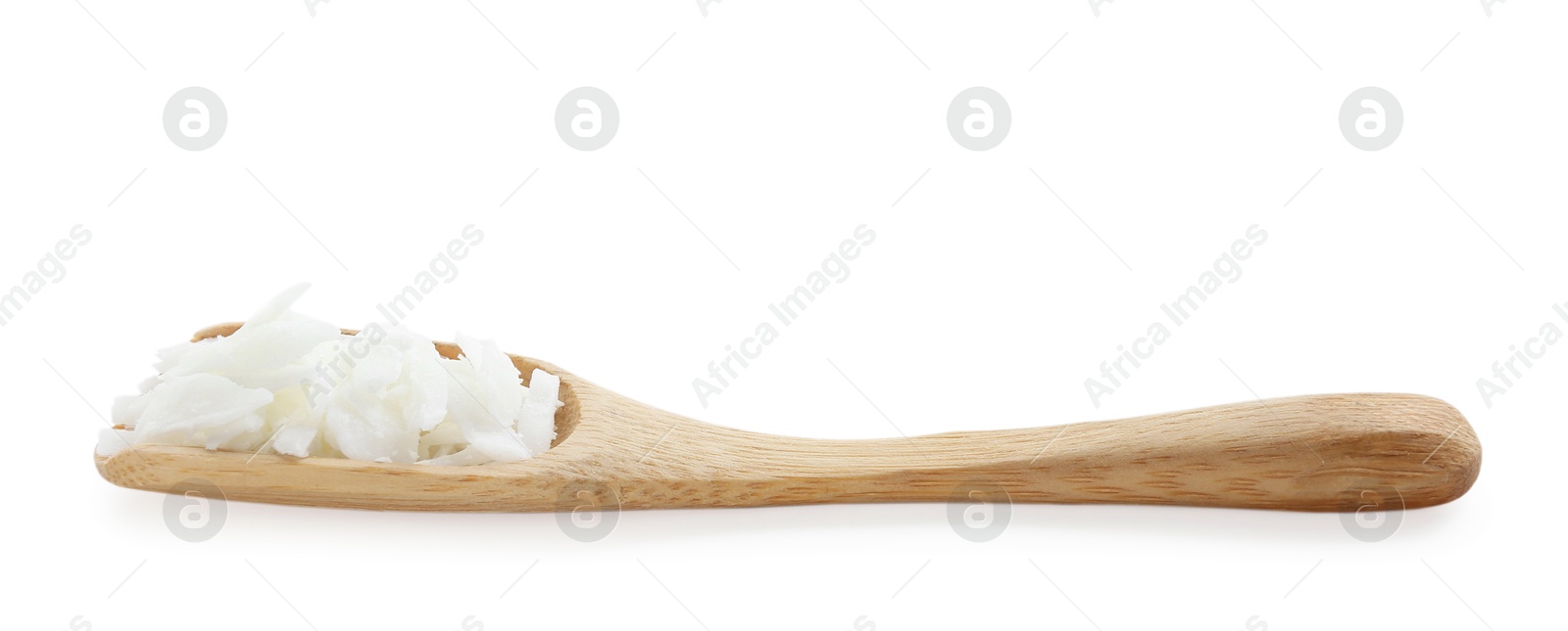 Photo of Soy wax in wooden spoon isolated on white