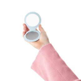 Woman holding pocket mirror on white background, closeup