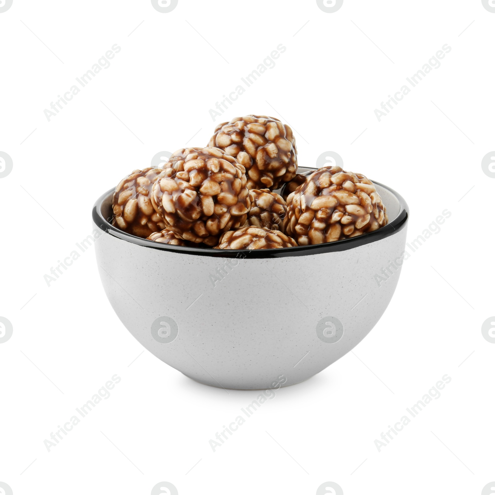 Photo of Delicious chocolate puffed rice balls in bowl isolated on white