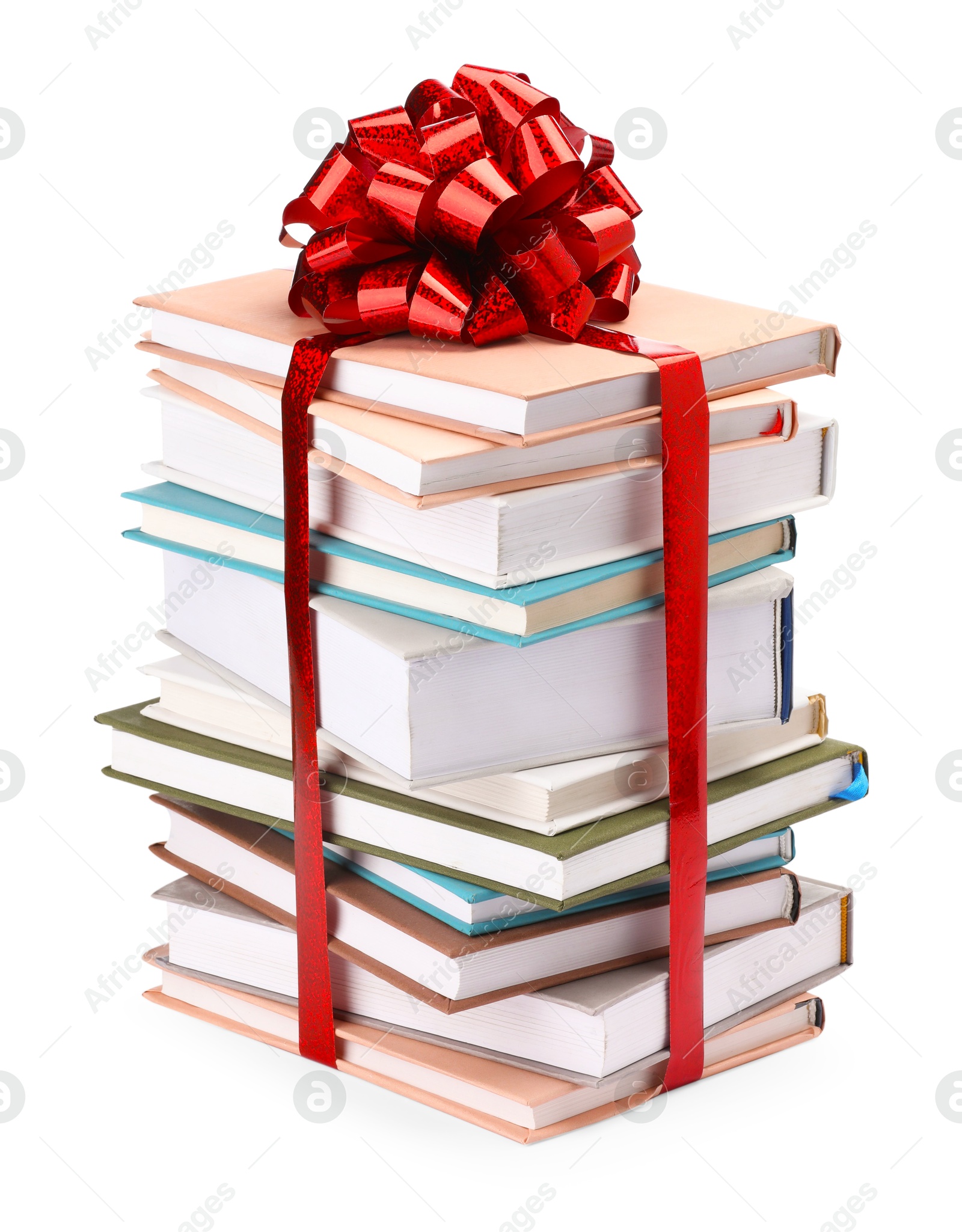 Photo of Stack of books with red bow as gift isolated on white