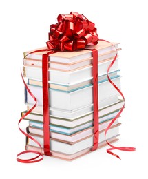 Photo of Stack of books with red bow as gift isolated on white