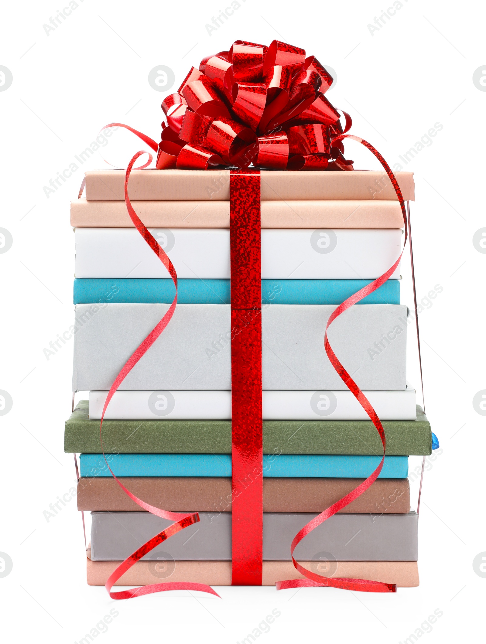 Photo of Stack of books with red bow as gift isolated on white