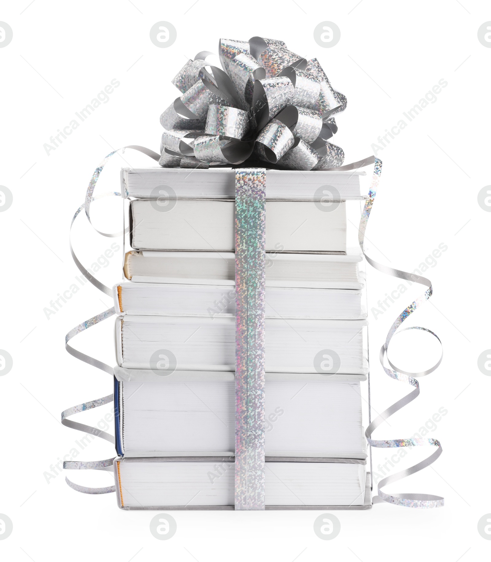 Photo of Stack of books with silver bow as gift isolated on white