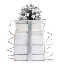 Photo of Stack of books with silver bow as gift isolated on white