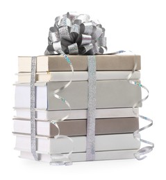 Photo of Stack of books with silver bow as gift isolated on white