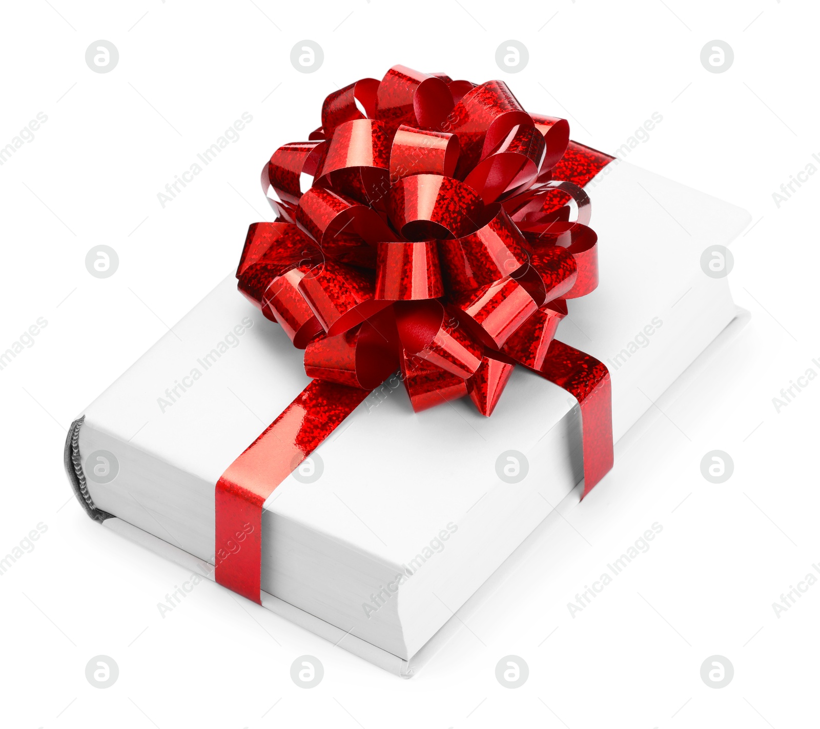 Photo of One book with red bow as gift isolated on white