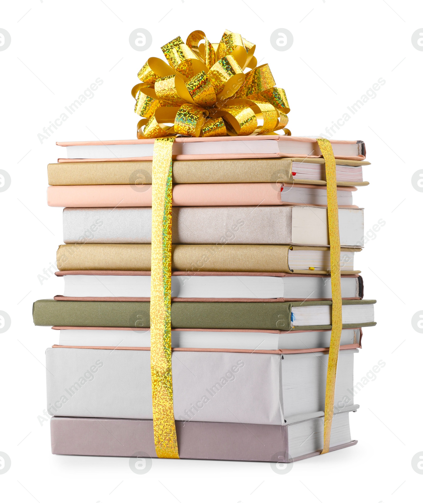 Photo of Stack of books with golden bow as gift isolated on white