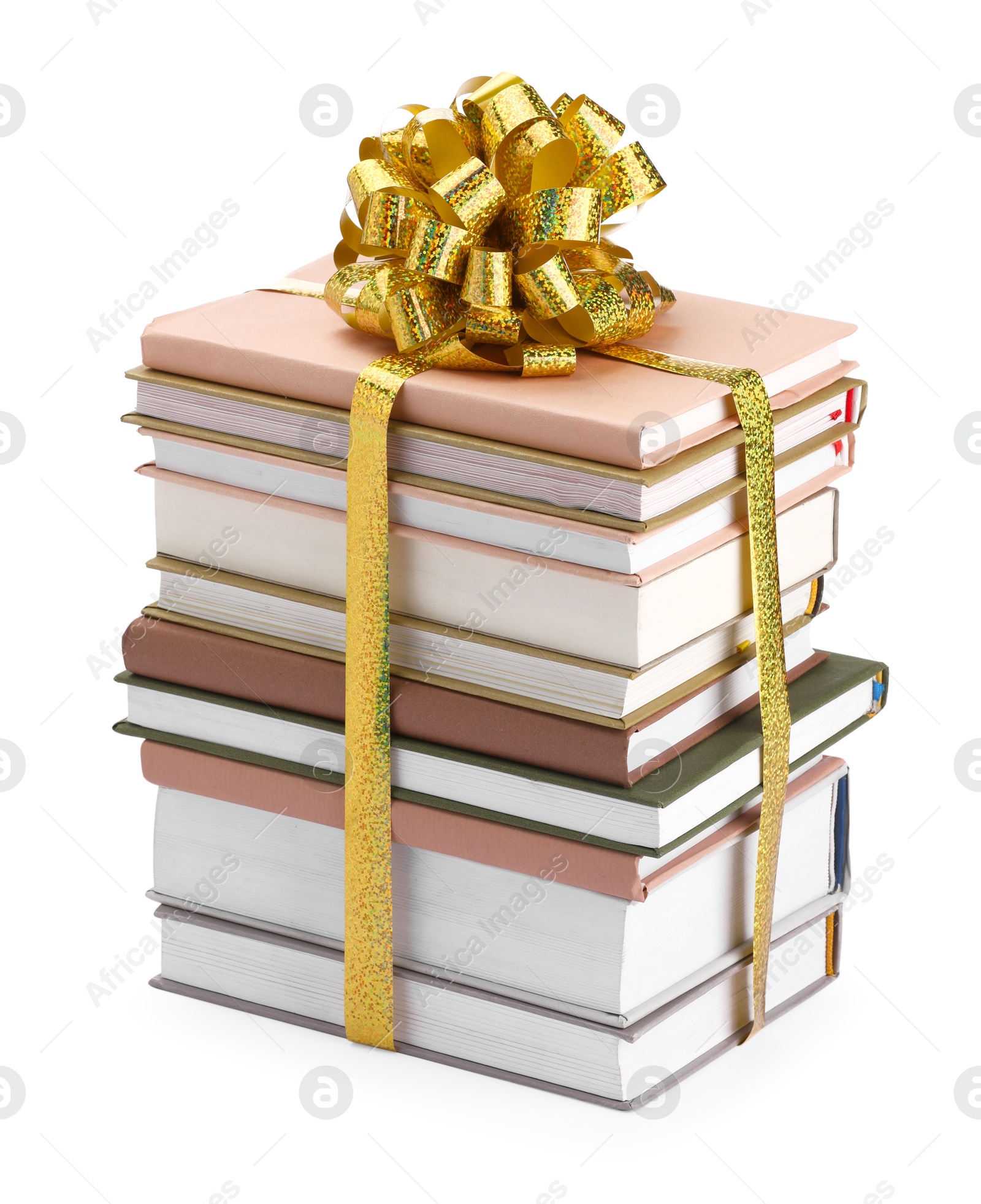 Photo of Stack of books with golden bow as gift isolated on white