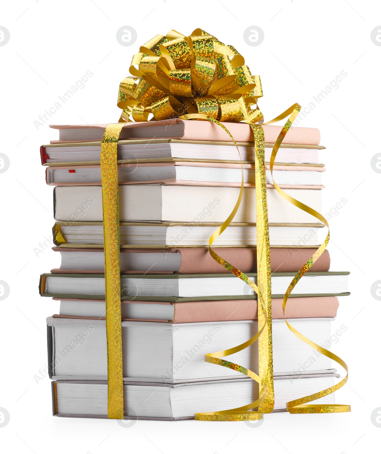 Photo of Stack of books with golden bow as gift isolated on white