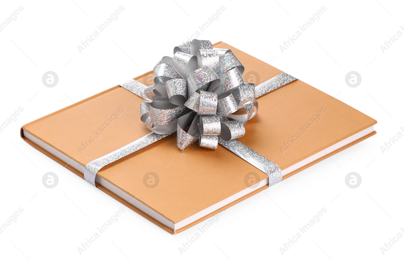 Photo of One book with silver bow as gift isolated on white