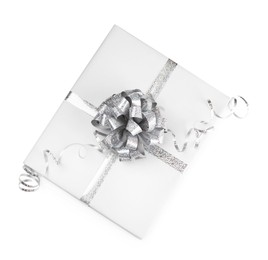 Photo of One book with silver bow as gift isolated on white, top view