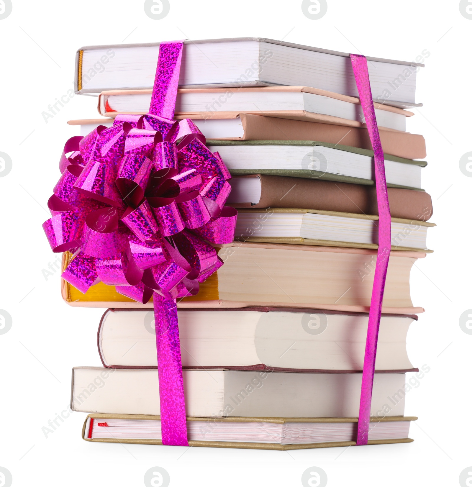 Photo of Stack of books with purple bow as gift isolated on white