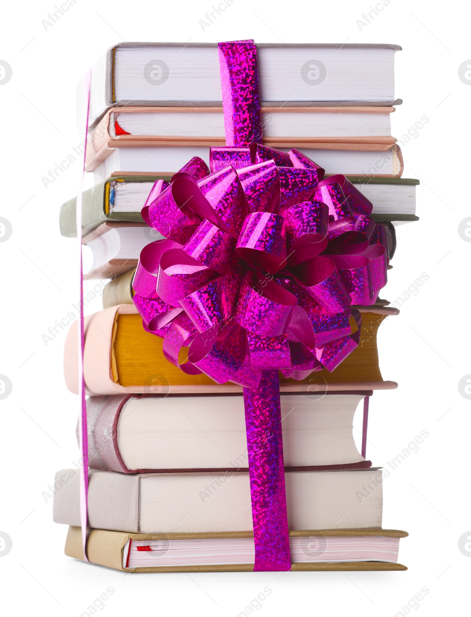 Photo of Stack of books with purple bow as gift isolated on white