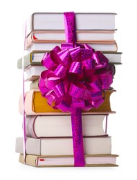 Photo of Stack of books with purple bow as gift isolated on white