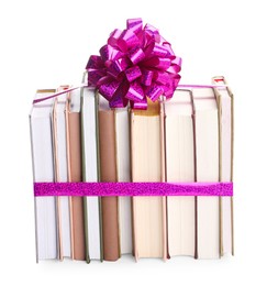 Photo of Books with purple bow as gift isolated on white