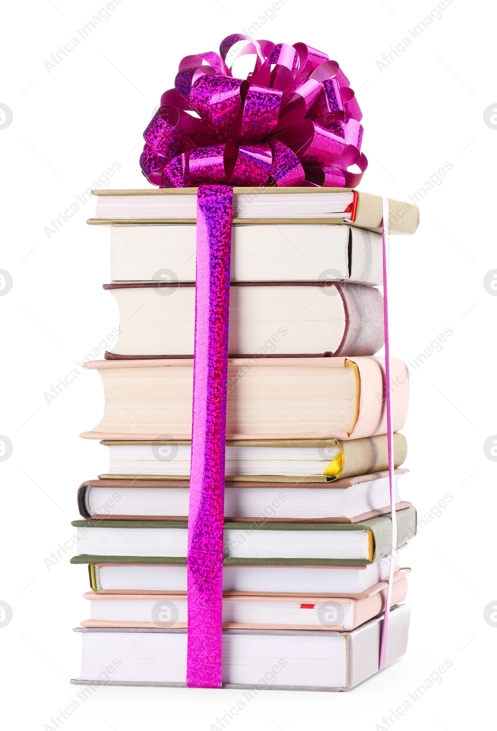 Photo of Stack of books with purple bow as gift isolated on white