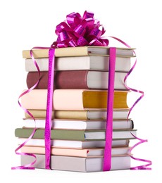 Photo of Stack of books with purple bow as gift isolated on white