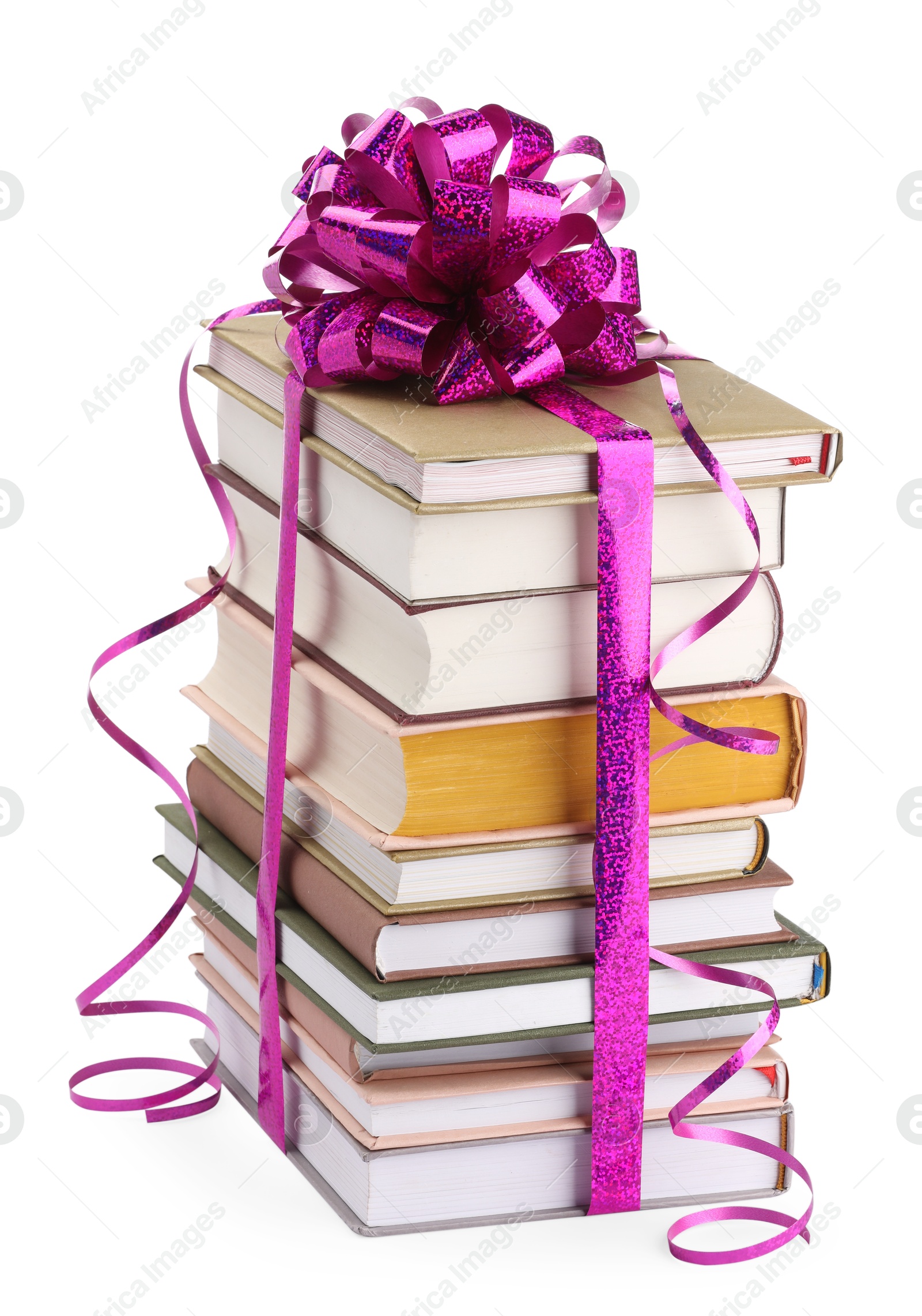 Photo of Stack of books with purple bow as gift isolated on white