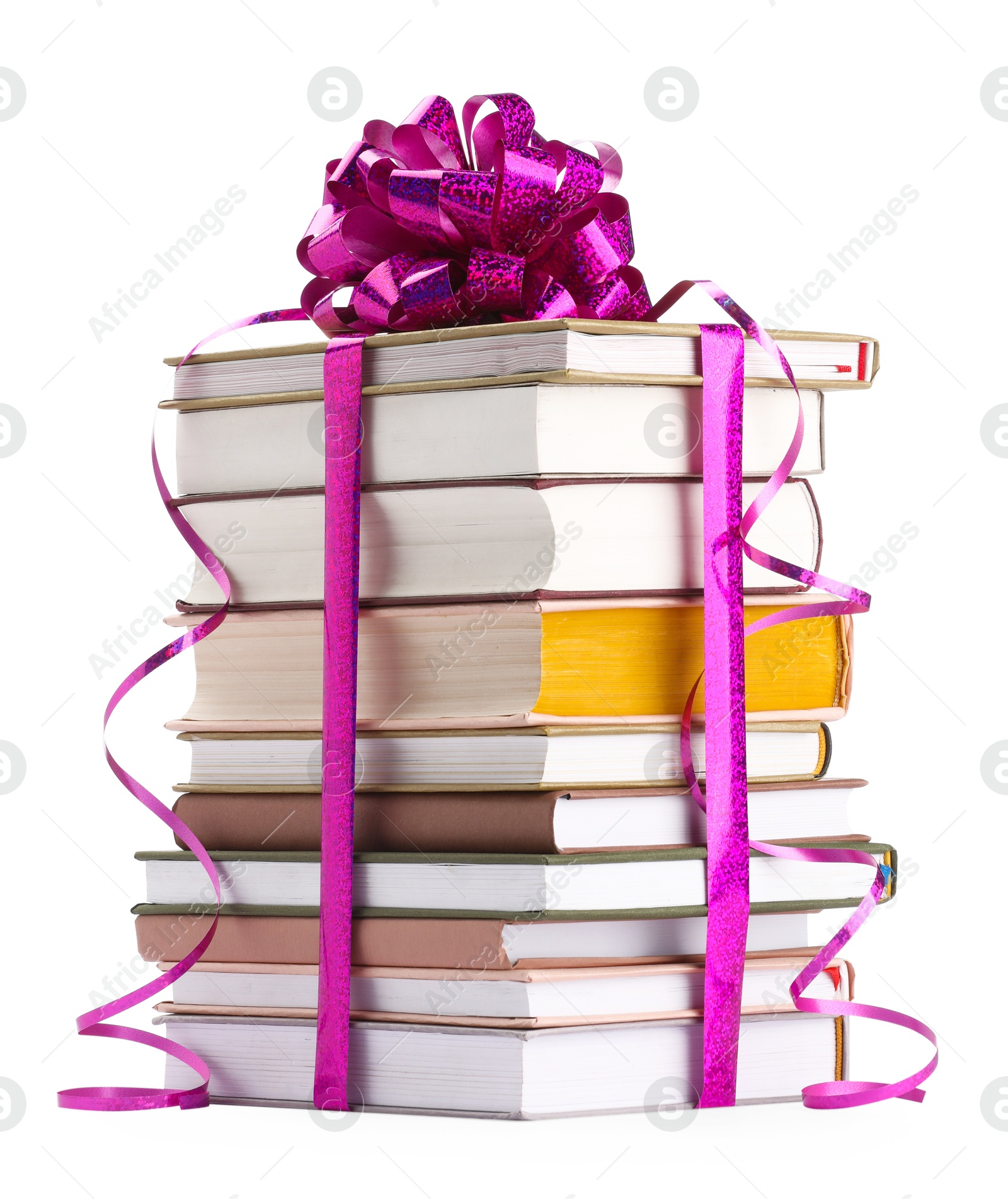 Photo of Stack of books with purple bow as gift isolated on white