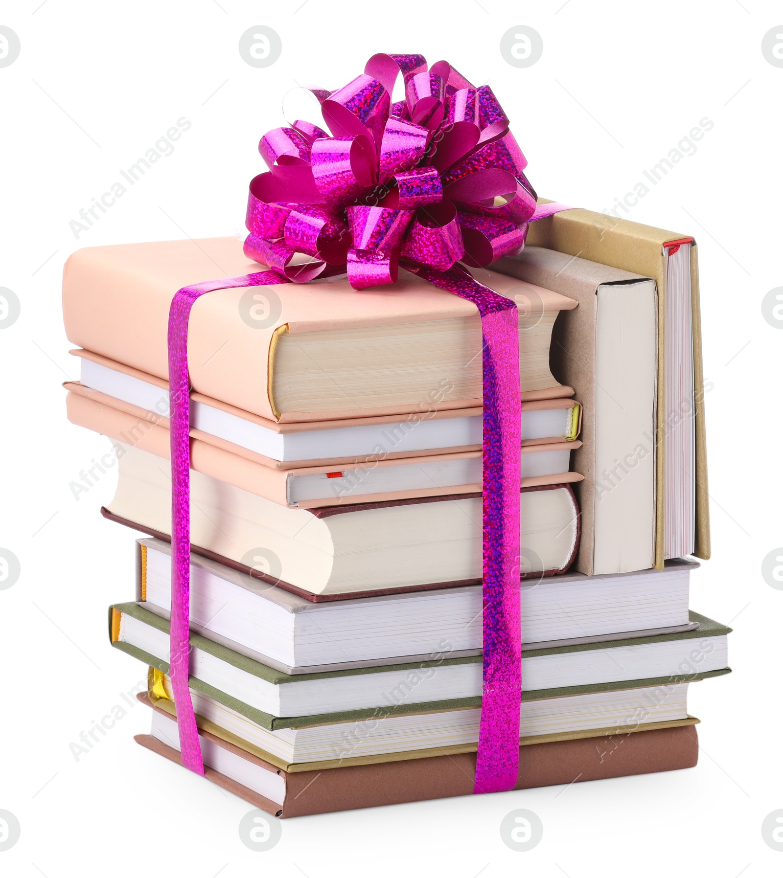 Photo of Stack of books with purple bow as gift isolated on white