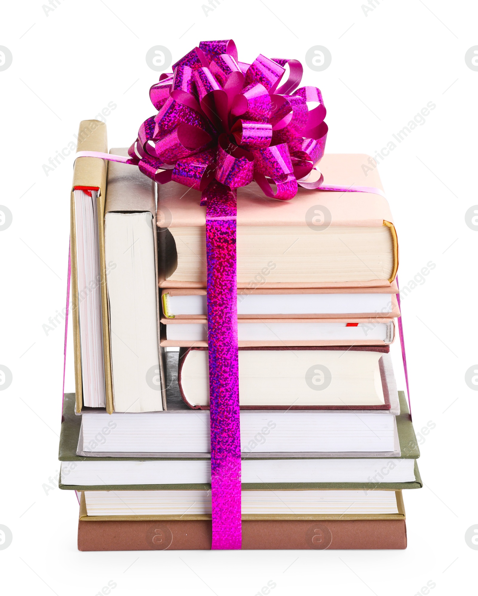 Photo of Stack of books with purple bow as gift isolated on white