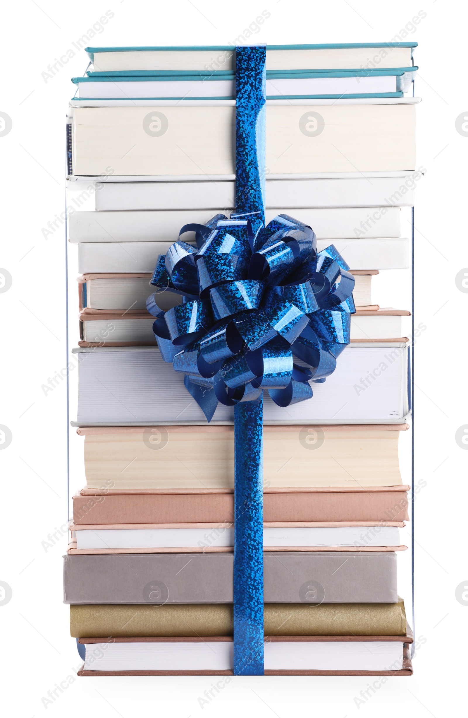 Photo of Stack of books with blue bow as gift isolated on white