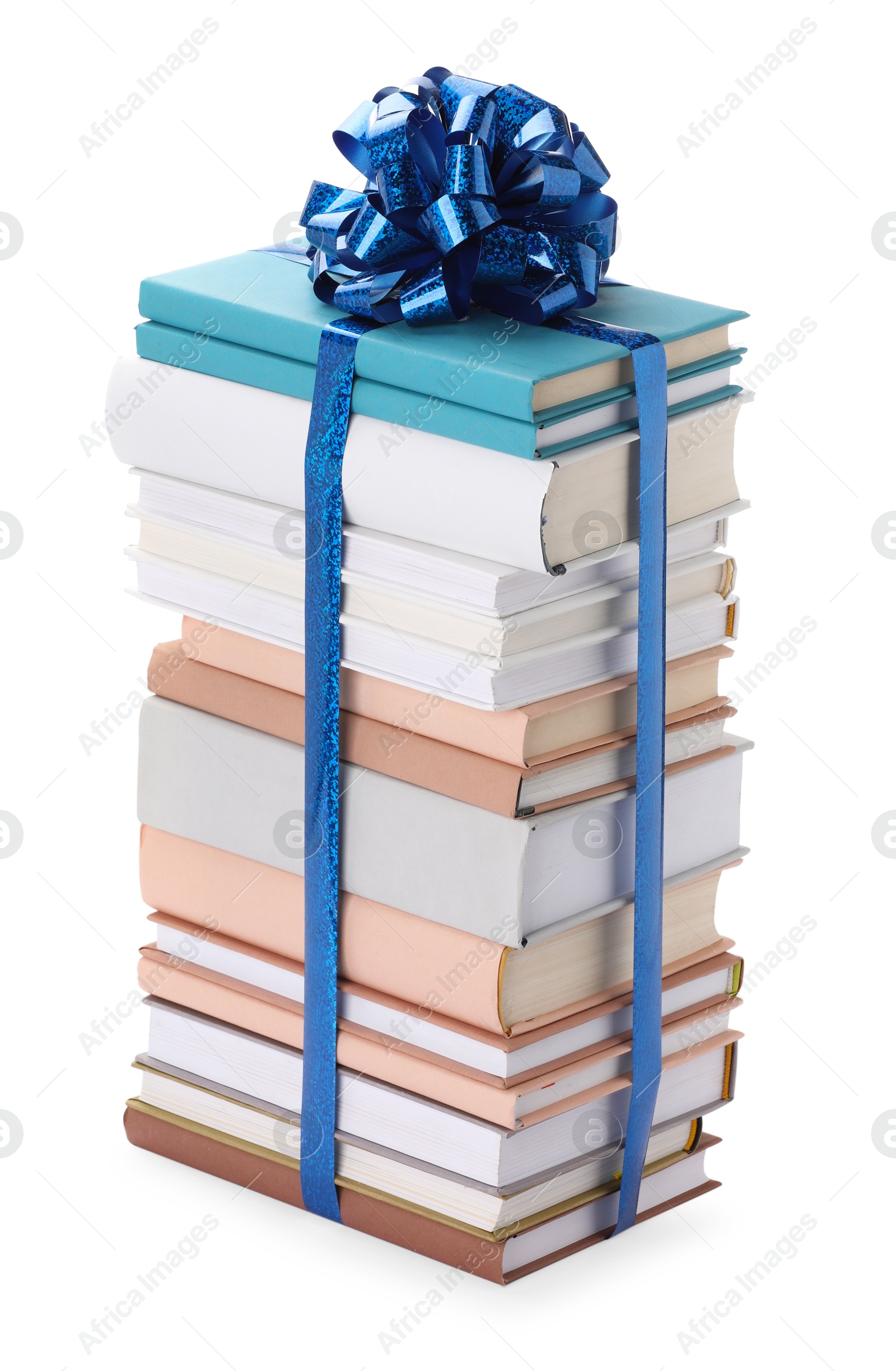 Photo of Stack of books with blue bow as gift isolated on white