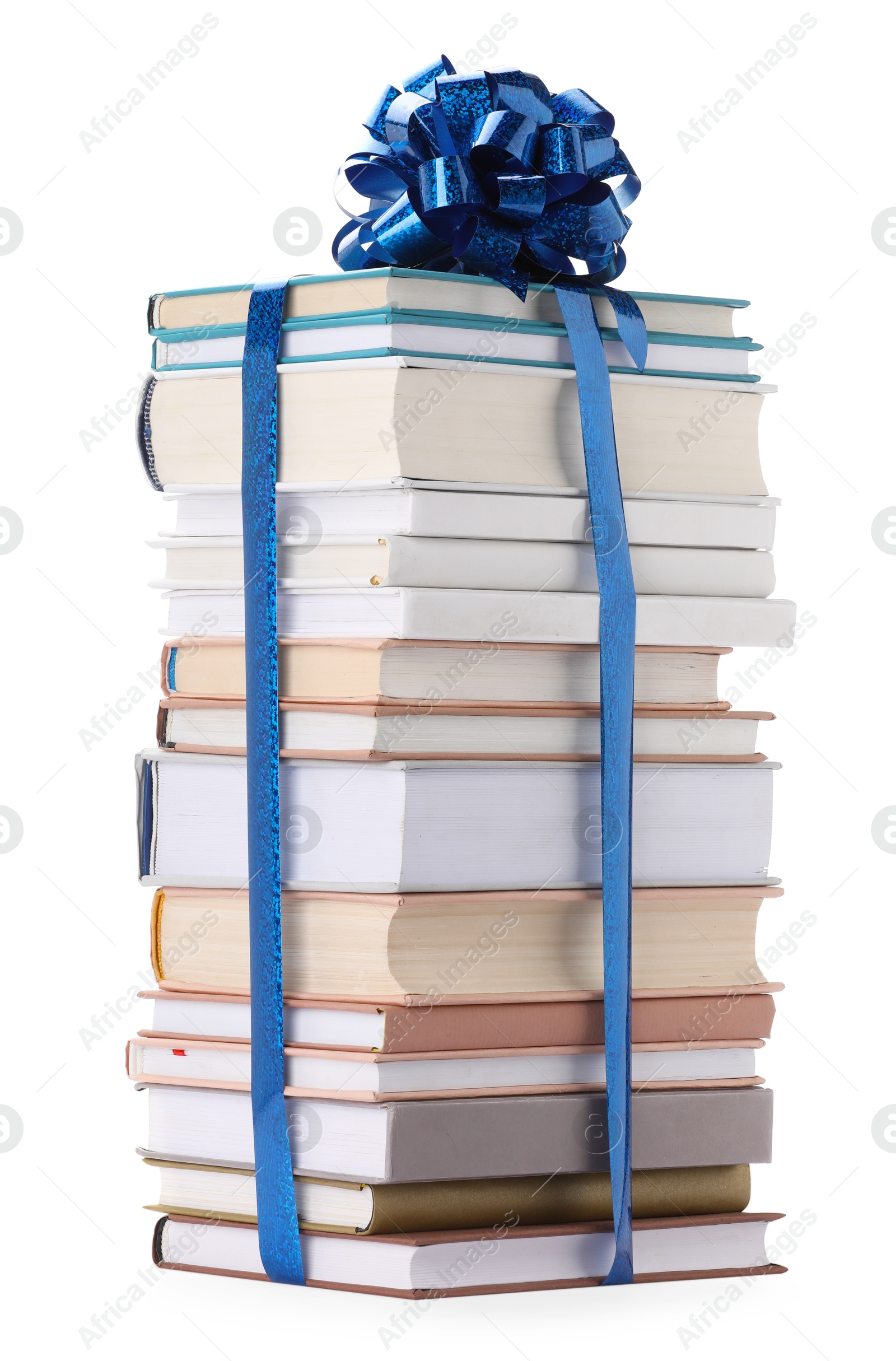 Photo of Stack of books with blue bow as gift isolated on white