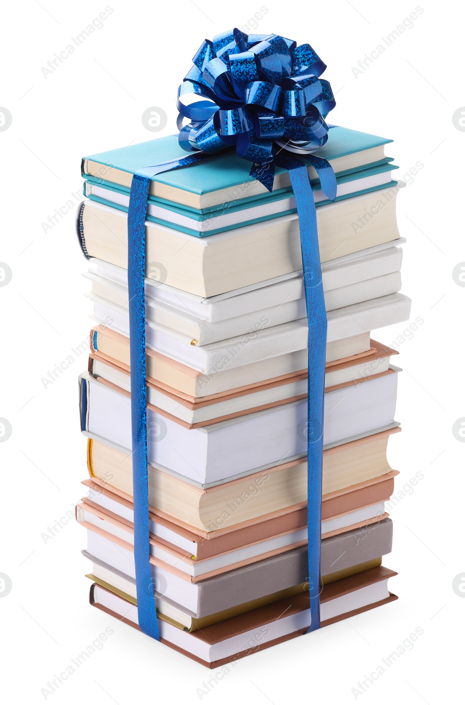 Photo of Stack of books with blue bow as gift isolated on white