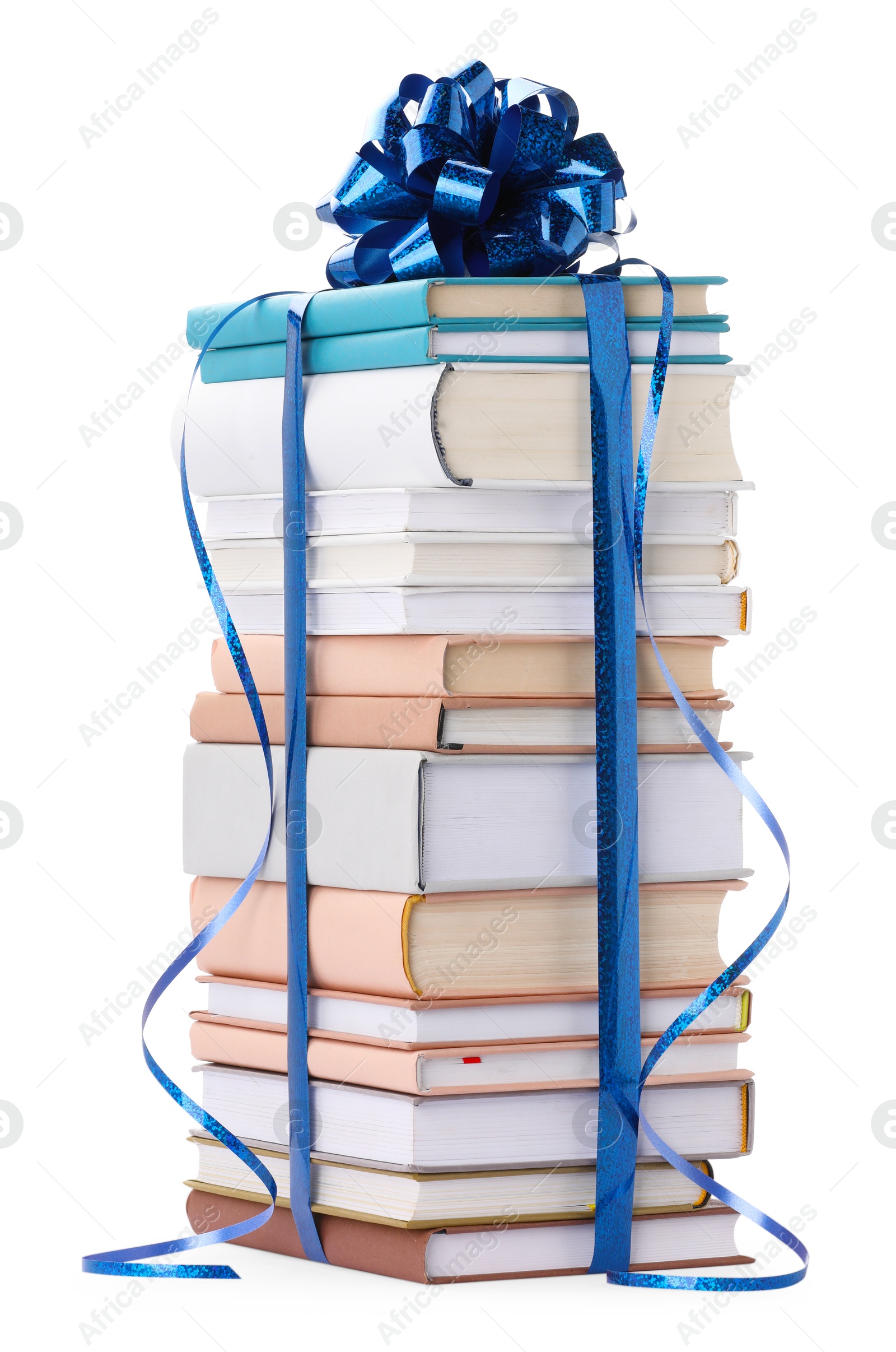 Photo of Stack of books with blue bow as gift isolated on white