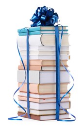 Photo of Stack of books with blue bow as gift isolated on white