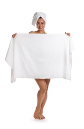 Photo of Beautiful young woman hiding behind towel on white background