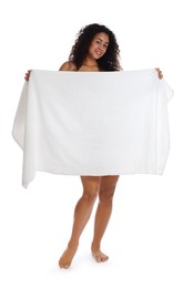 Photo of Beautiful young woman hiding behind towel on white background