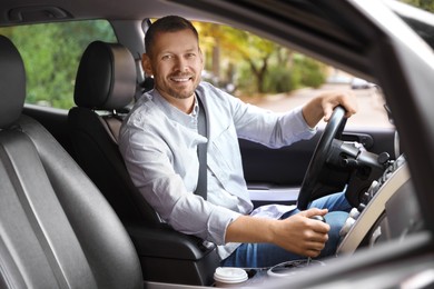 Photo of Man driving modern car, view through window