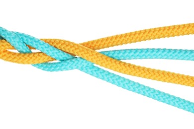 Photo of Colorful ropes tied together isolated on white, top view. Unity concept