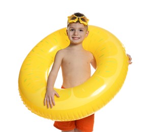 Photo of Cute little boy in beachwear with diving mask and inflatable ring on white background