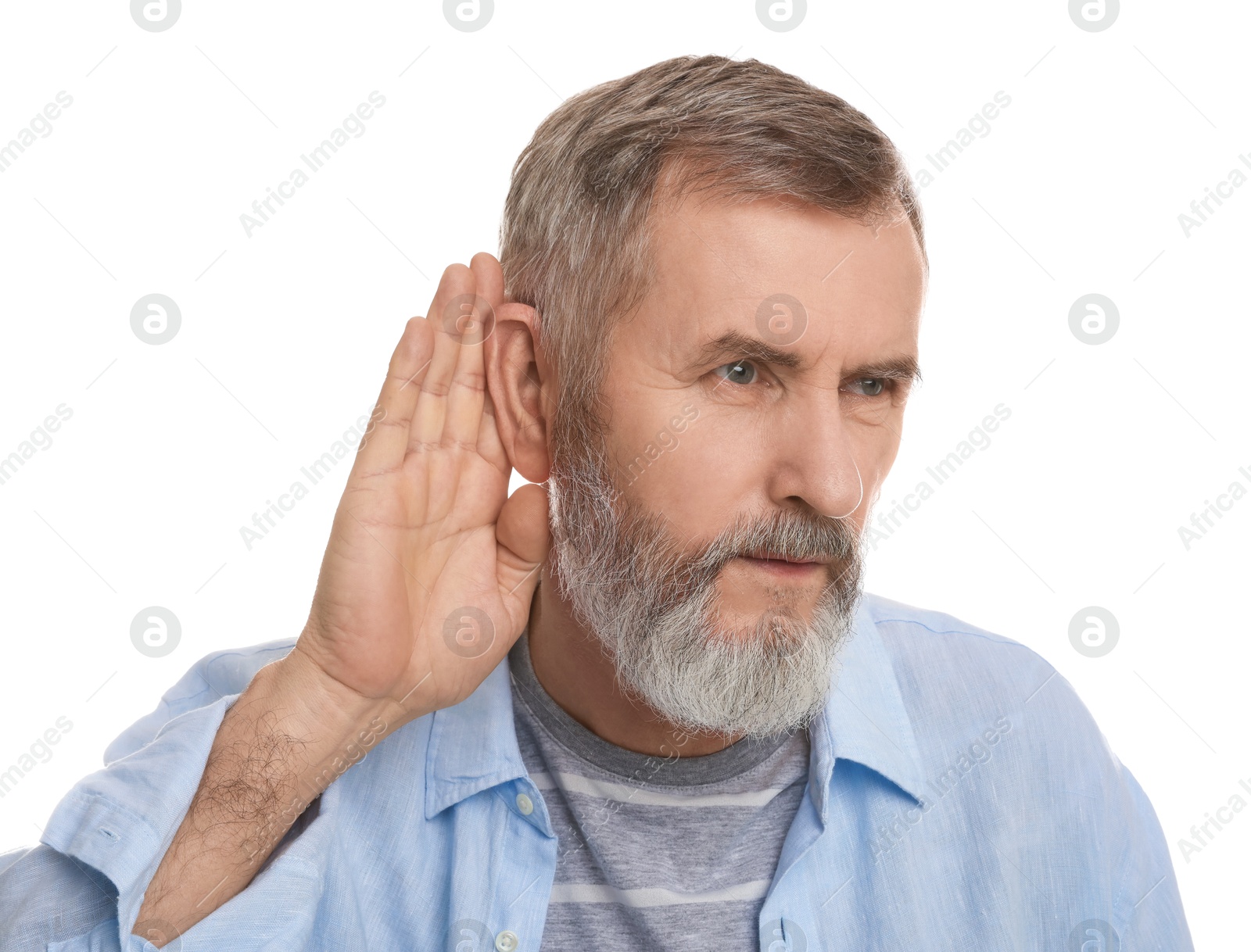 Photo of Senior man showing hand to ear gesture on white background