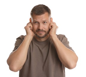 Photo of Man covering his ears with fingers on white background