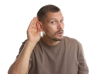 Photo of Man showing hand to ear gesture on white background