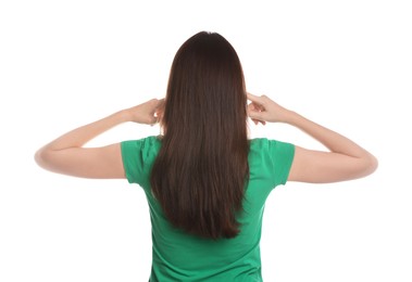 Photo of Woman covering her ears with fingers on white background, back view