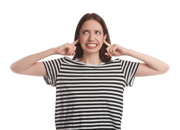 Photo of Woman covering her ears with fingers on white background